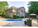 Home exterior showcasing the pool, gazebo, and beautiful landscaping in the backyard at 101 Quarryrock Rd, Holly Springs, NC 27540