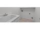 Practical laundry room with a utility sink and tiled floor at 101 Quarryrock Rd, Holly Springs, NC 27540