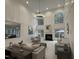 Spacious living room features a fireplace, high ceilings, and large windows for ample natural light at 101 Quarryrock Rd, Holly Springs, NC 27540