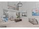 Inviting living room with a view of the kitchen, featuring an open floor plan and modern decor at 101 Quarryrock Rd, Holly Springs, NC 27540