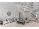Spacious living room with soaring ceilings, a large mirror, and staircase at 101 Quarryrock Rd, Holly Springs, NC 27540