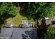 Aerial view of a backyard featuring a large deck and green space, perfect for outdoor living and entertaining at 102 Turnberry Ln, Cary, NC 27518