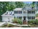 Beautiful two-story home with a manicured lawn, two-car garage, and inviting front steps at 102 Turnberry Ln, Cary, NC 27518