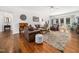 Spacious living room showcases hardwood floors, leather furniture, and an open layout at 102 Turnberry Ln, Cary, NC 27518