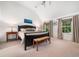 Serene bedroom with a vaulted ceiling, neutral walls, and an abundance of natural light at 102 Turnberry Ln, Cary, NC 27518