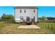 Spacious backyard featuring a patio, deck, and fenced-in yard, perfect for outdoor entertaining and relaxation at 102 Williamson Place Dr, Princeton, NC 27569