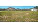 Large backyard with a wooden fence and storage shed at 102 Williamson Place Dr, Princeton, NC 27569