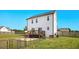 Large backyard featuring a wooden fence, deck, and patio at 102 Williamson Place Dr, Princeton, NC 27569