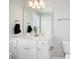 Bright bathroom featuring a single vanity with white cabinets and a commode at 102 Williamson Place Dr, Princeton, NC 27569