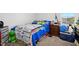 Cozy bedroom featuring carpet floors, a window view, and wooden dresser at 102 Williamson Place Dr, Princeton, NC 27569