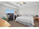 Spacious bedroom with ceiling fan, plush carpet, and a large window at 102 Williamson Place Dr, Princeton, NC 27569