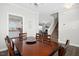 Dining room view showing the staircase, living room and modern kitchen at 102 Williamson Place Dr, Princeton, NC 27569