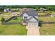 Charming two-story home features a well-maintained yard, attached garage, and a welcoming front porch at 102 Williamson Place Dr, Princeton, NC 27569