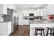 Bright kitchen boasts stainless steel appliances and granite countertops with seating at 102 Williamson Place Dr, Princeton, NC 27569