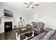 Inviting living room featuring a cozy fireplace and comfortable furniture at 102 Williamson Place Dr, Princeton, NC 27569