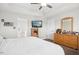 This spacious main bedroom features neutral walls, ceiling fan, and an ensuite bathroom at 102 Williamson Place Dr, Princeton, NC 27569
