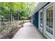 Back patio connects to the natural wooded backyard offering relaxing views through large windows at 103 Summerlin Dr Dr, Chapel Hill, NC 27514