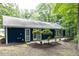 Charming home with a patio, natural landscaping, and a wooded backdrop at 103 Summerlin Dr Dr, Chapel Hill, NC 27514