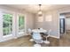 Cozy dining area with natural light, modern lighting, and a view of the outdoors at 103 Summerlin Dr Dr, Chapel Hill, NC 27514