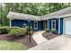Inviting entrance with a walkway and a cozy porch, surrounded by mature landscaping at 103 Summerlin Dr Dr, Chapel Hill, NC 27514