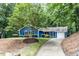 Inviting home with a lush front lawn and mature trees offering great curb appeal at 103 Summerlin Dr Dr, Chapel Hill, NC 27514