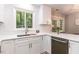 Modern kitchen with white cabinets, stainless steel appliances, and a window above the sink at 103 Summerlin Dr Dr, Chapel Hill, NC 27514