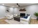 Bright living room featuring a fireplace, modern decor, and comfortable seating at 103 Summerlin Dr Dr, Chapel Hill, NC 27514