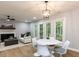 Bright living space featuring modern furnishings, a fireplace, and a dining area at 103 Summerlin Dr Dr, Chapel Hill, NC 27514