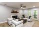 Bright living room with a fireplace, contemporary seating, and access to outdoor patio at 103 Summerlin Dr Dr, Chapel Hill, NC 27514