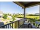 Cozy balcony with chairs overlooking a neighborhood and green space at 1041 Pemberly Ave, Morrisville, NC 27560