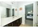 The bathroom features a large mirror over the vanity and a doorway leading to a bedroom at 1041 Pemberly Ave, Morrisville, NC 27560
