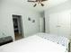 This bedroom has pale grey walls, a ceiling fan, and a large double door closet at 1041 Pemberly Ave, Morrisville, NC 27560