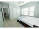 The bedroom has pale grey walls, a ceiling fan, a double door closet, and large windows at 1041 Pemberly Ave, Morrisville, NC 27560