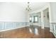 Open dining and living area showcases hardwood floors and natural light throughout at 1041 Pemberly Ave, Morrisville, NC 27560