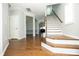 Inviting entryway with hardwood floors, staircase, and neutral paint scheme at 1041 Pemberly Ave, Morrisville, NC 27560