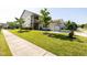 Beautiful two-story home boasts a well-manicured lawn, attached garage, and second story balcony at 1041 Pemberly Ave, Morrisville, NC 27560