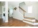Inviting foyer showcasing hardwood floors, staircase and lots of natural light at 1041 Pemberly Ave, Morrisville, NC 27560
