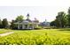 Picturesque community gazebo with an American flag surrounded by lush greenery and landscaping at 1041 Pemberly Ave, Morrisville, NC 27560