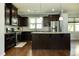 Well-equipped kitchen boasts granite countertops, stainless steel appliances, and a functional island at 1041 Pemberly Ave, Morrisville, NC 27560