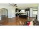 Spacious kitchen with stainless appliances, dark wood cabinets, and a center island at 1041 Pemberly Ave, Morrisville, NC 27560
