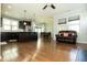 Open-concept living space flows from the kitchen with island seating to the living room at 1041 Pemberly Ave, Morrisville, NC 27560