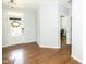 Hardwood floored room with white walls, ceiling fan, white door and white door trim at 1041 Pemberly Ave, Morrisville, NC 27560