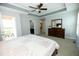The main bedroom has a queen bed, a large dresser, and a door to a small patio at 1041 Pemberly Ave, Morrisville, NC 27560