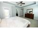The main bedroom has a queen bed, a large dresser, and a door to a small patio at 1041 Pemberly Ave, Morrisville, NC 27560