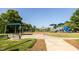 Well-maintained community playground area with swings, play structure, and picnic table at 1041 Pemberly Ave, Morrisville, NC 27560