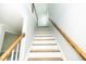 Bright staircase featuring wood and white trim and hardwood steps at 1041 Pemberly Ave, Morrisville, NC 27560