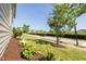 View of street with sidewalk, bushes and trees leading to a neighborhood at 1041 Pemberly Ave, Morrisville, NC 27560