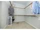 Organized walk-in closet with ample shelving and storage space for clothes and accessories at 1041 Pemberly Ave, Morrisville, NC 27560