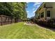 Well-maintained backyard with a brick patio and lush lawn, perfect for outdoor activities at 105 Everam Ct, Chapel Hill, NC 27516