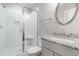 Clean bathroom showcasing glass shower with a bench and granite countertop vanity at 105 Everam Ct, Chapel Hill, NC 27516